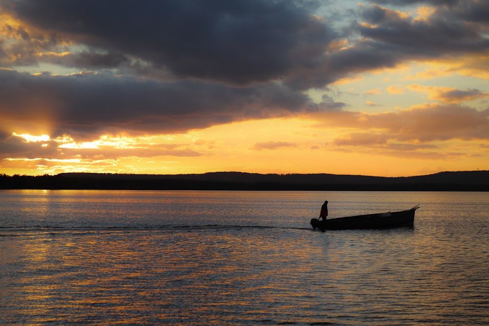 a person in a boat on a body of water