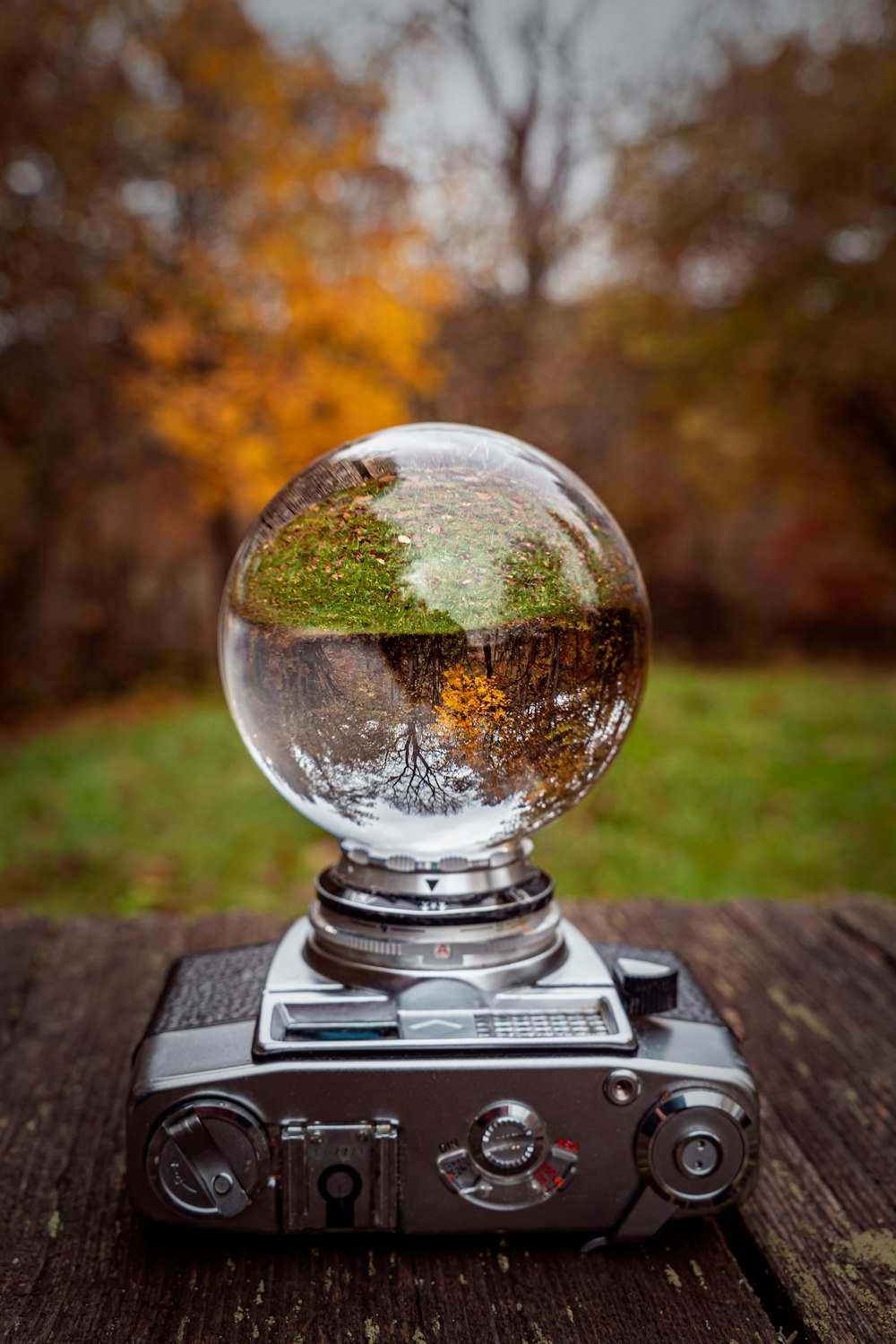 a camera sitting on top of a wooden table