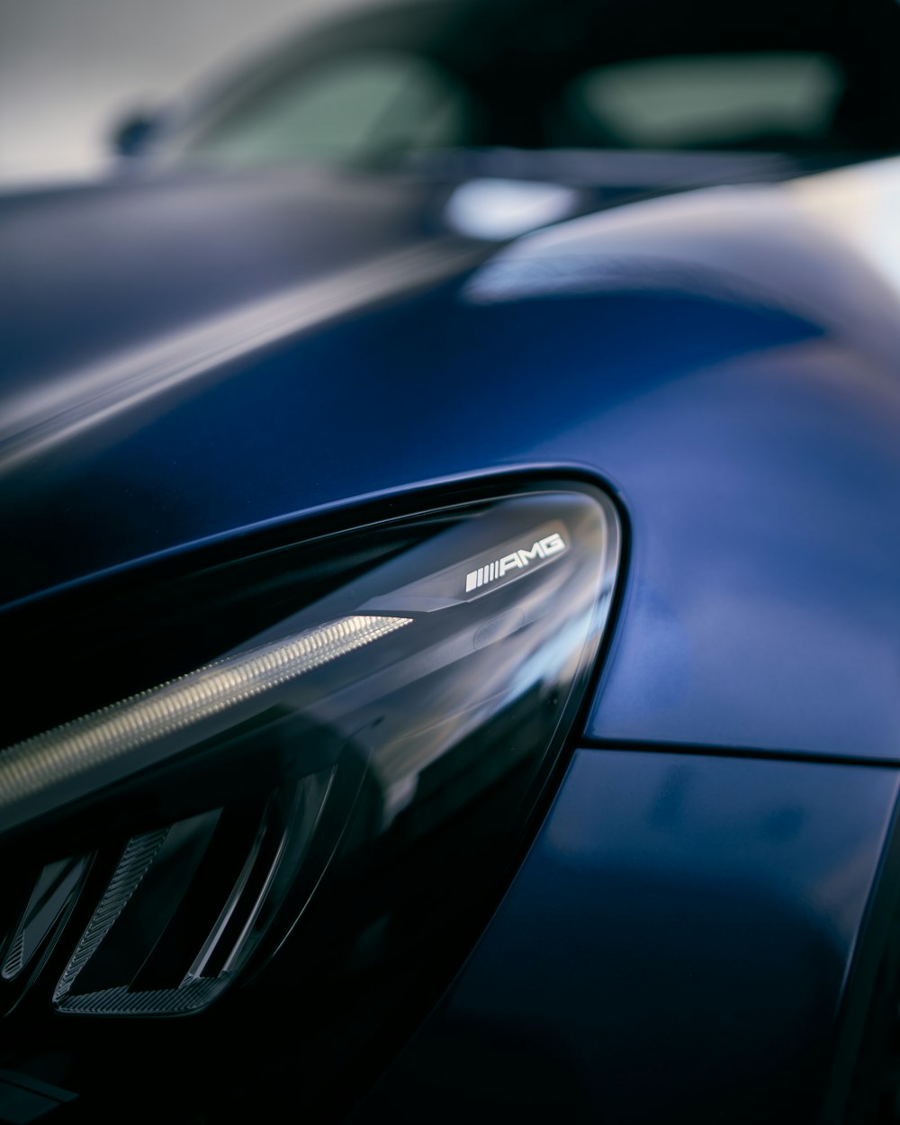 a close up of a blue sports car