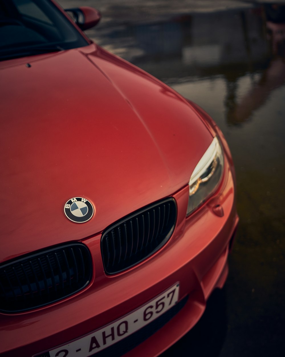 a close up of the front of a red car