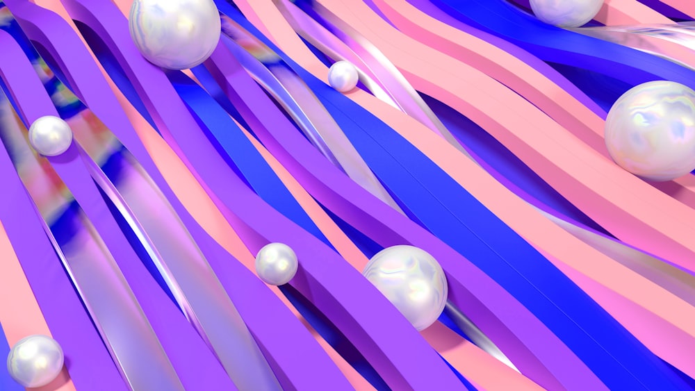 a group of white balls sitting on top of a purple and pink background