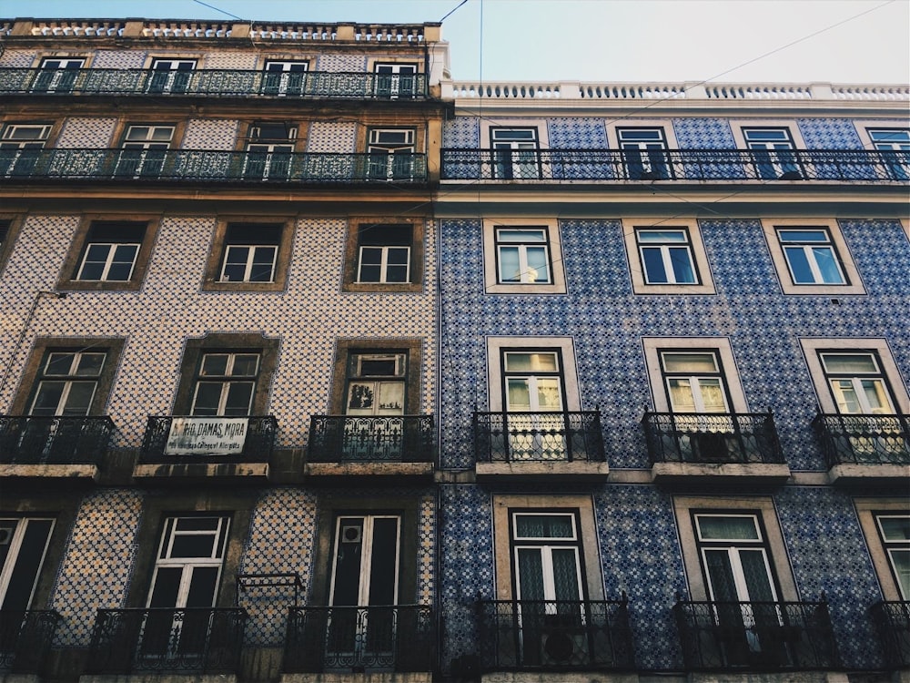 two buildings with balconies and balconies on them