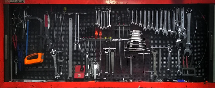 A red toolbox filled with tools