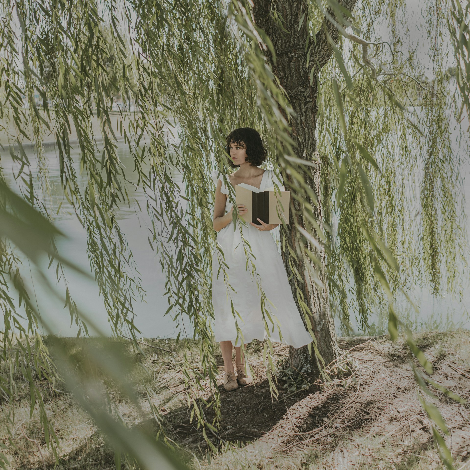 woman wearing yellow long-sleeved dress under white clouds and blue sky during daytime