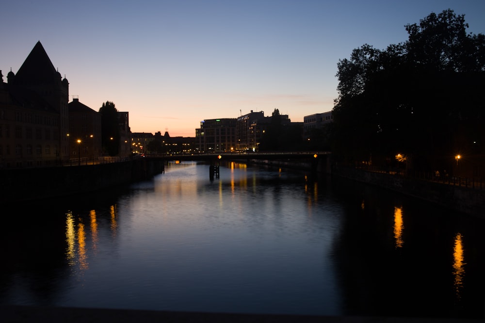 a river running through a city at night