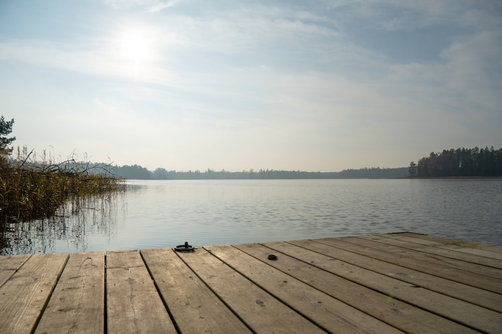 a wooden dock with a pair of shoes on it