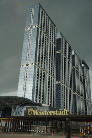 a very tall building with a sign in front of it