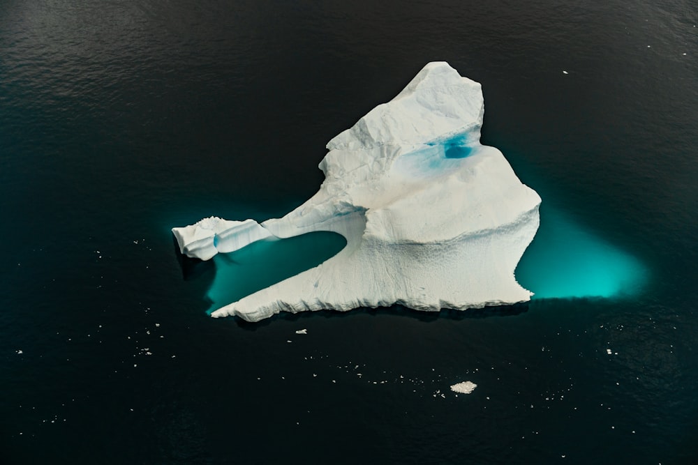 an iceberg floating in a body of water