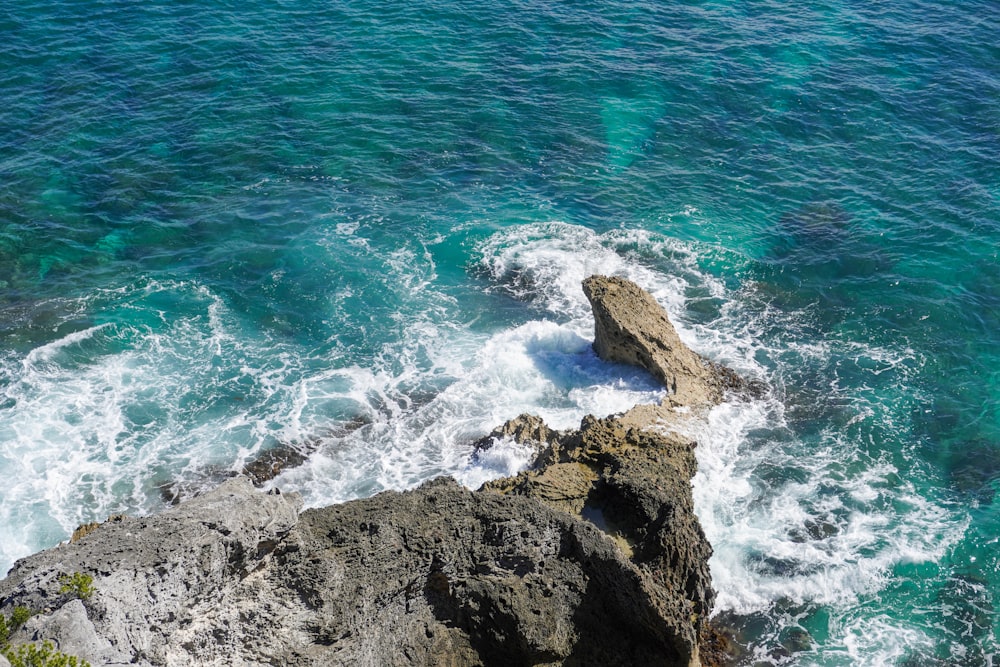a view of the ocean from the top of a cliff