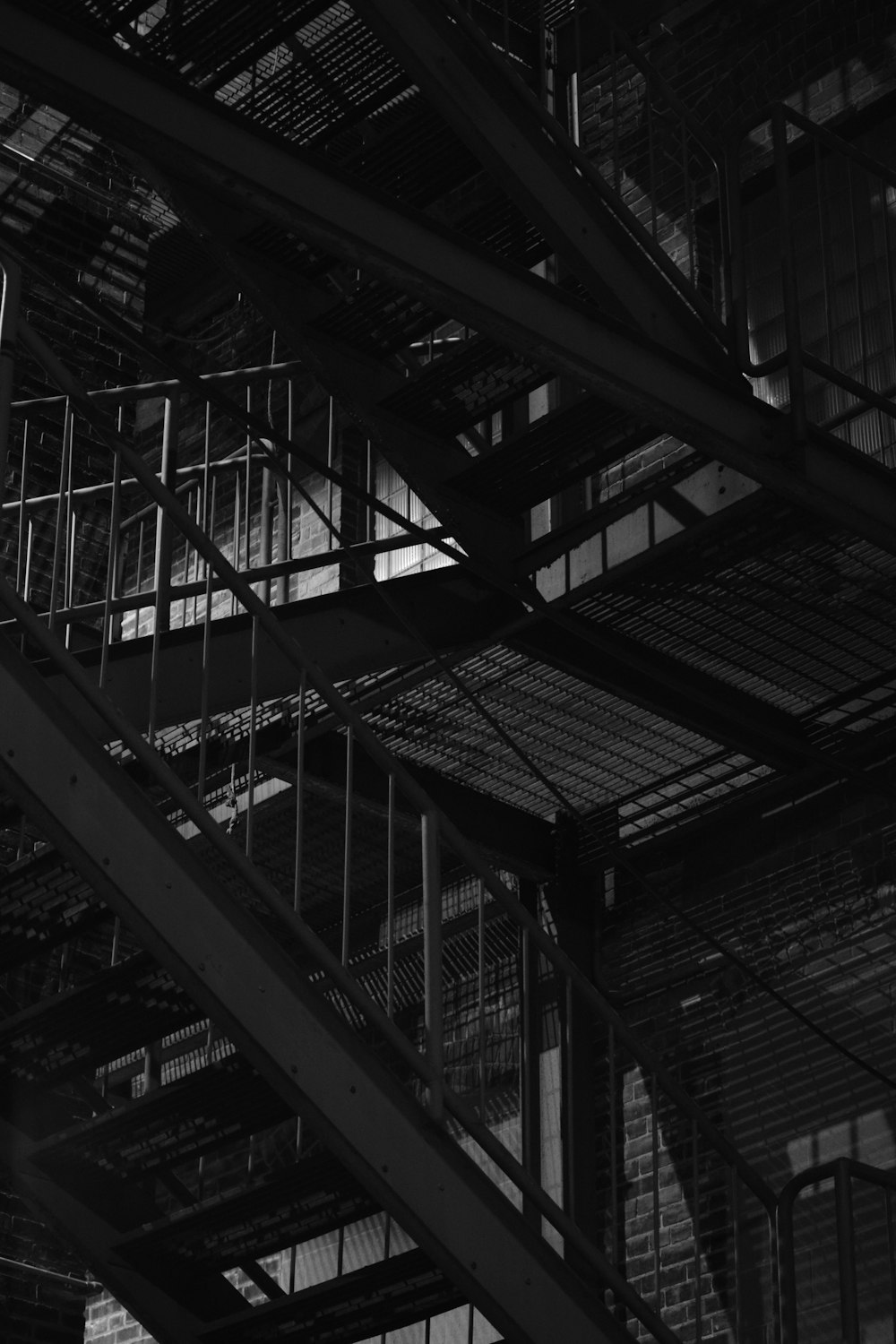 a black and white photo of a staircase