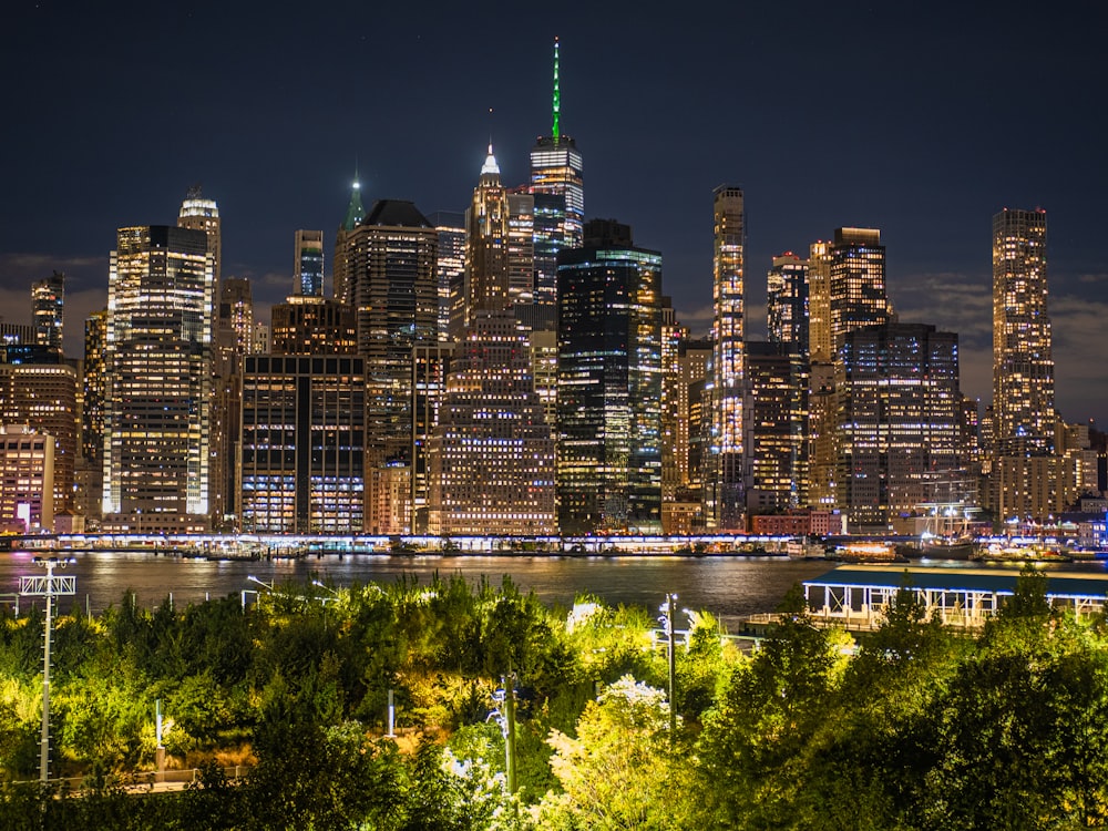 a night view of a city with tall buildings