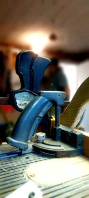 High-quality photo of heavy-duty clamps and fasteners in a workshop setting with modern tools around.