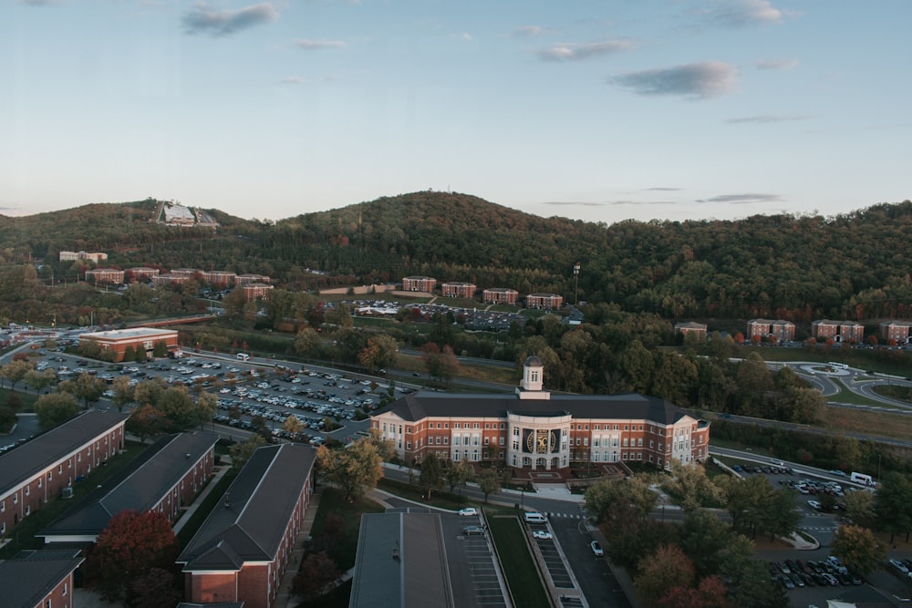an aerial view of a college campus and parking lot