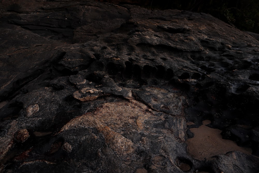 a large rock with some dirt on top of it