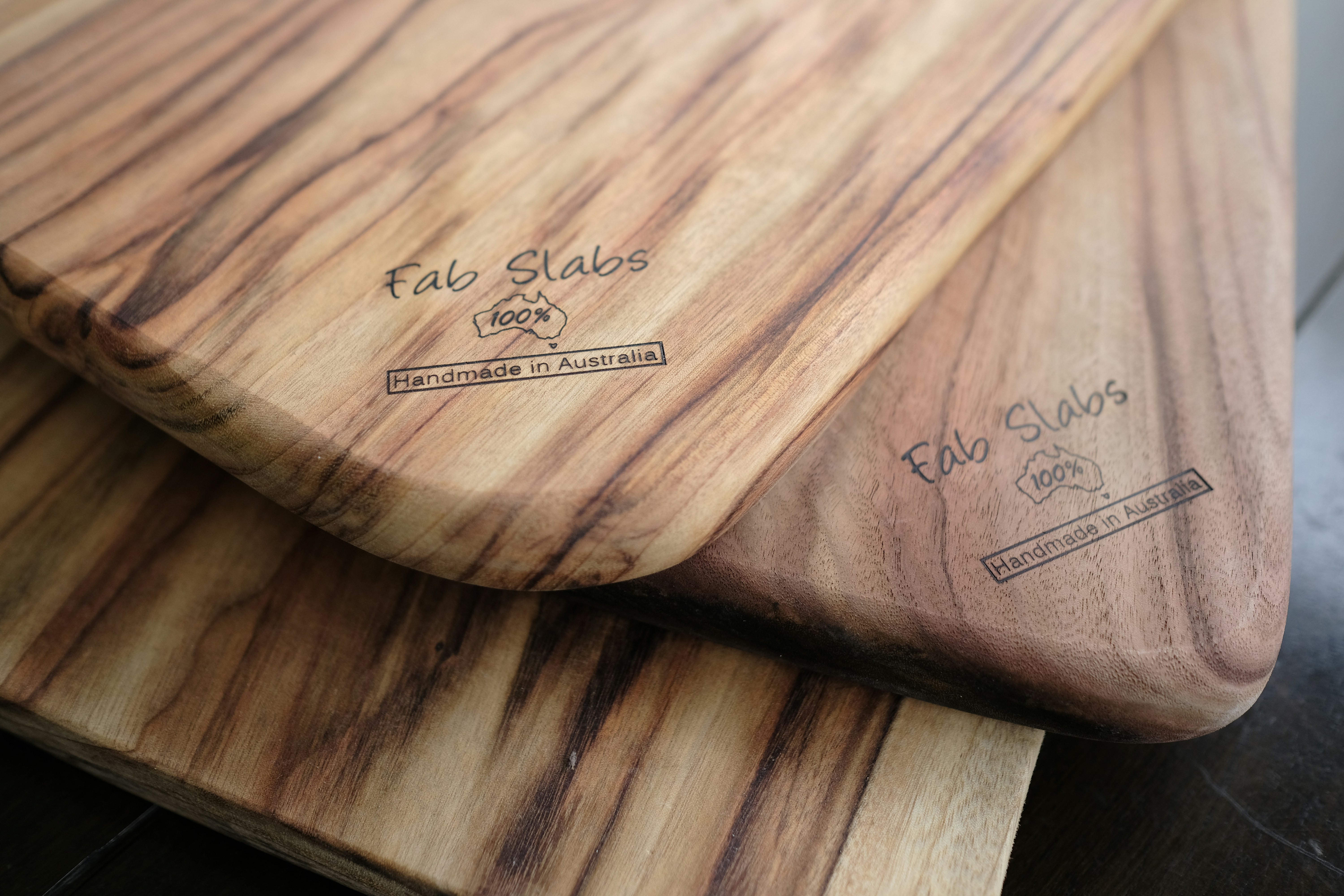 Two wooden cutting boards sitting on top of a table photo Free
