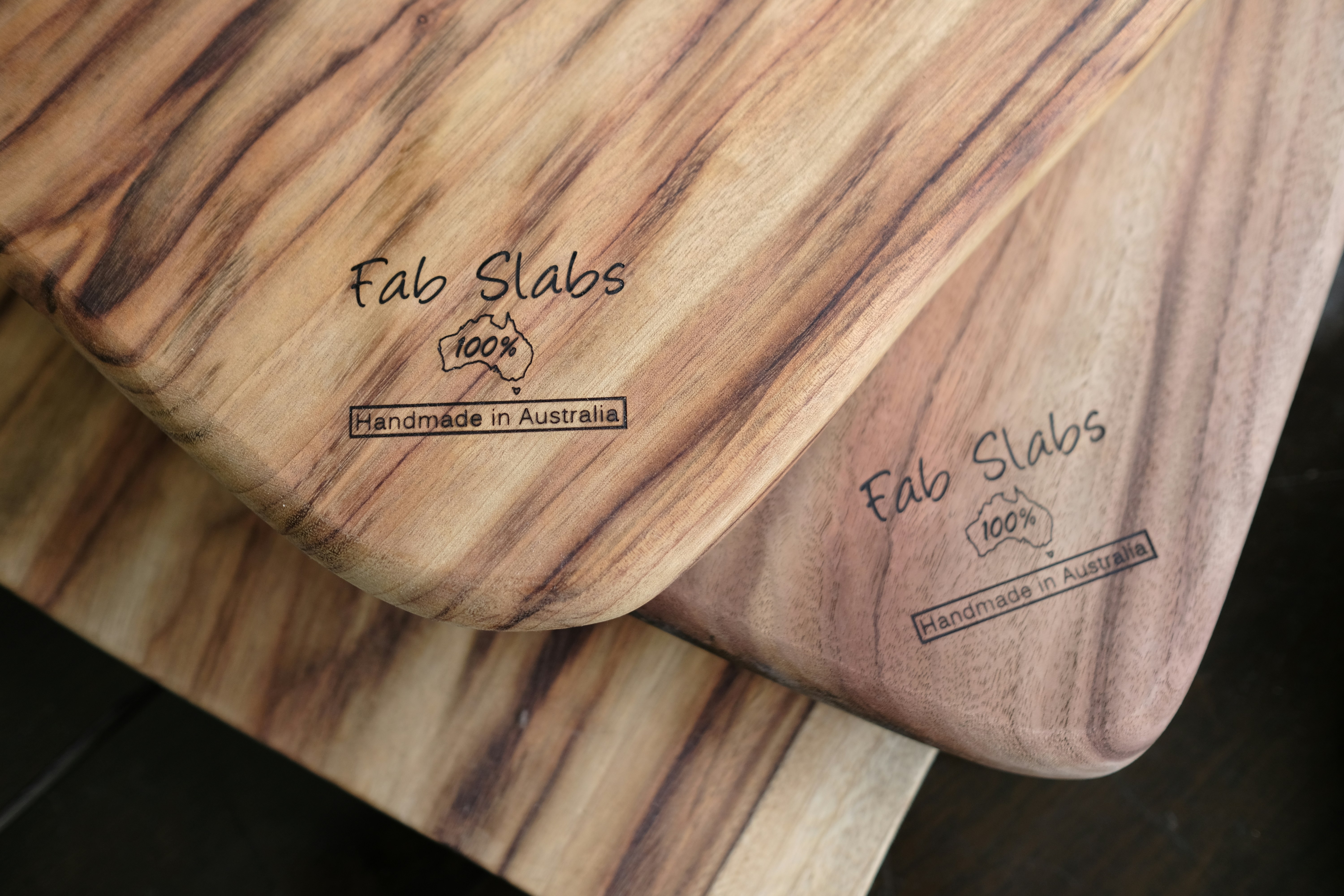 a couple of wooden boards sitting on top of a table