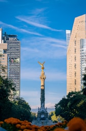 a view of a statue in the middle of a city