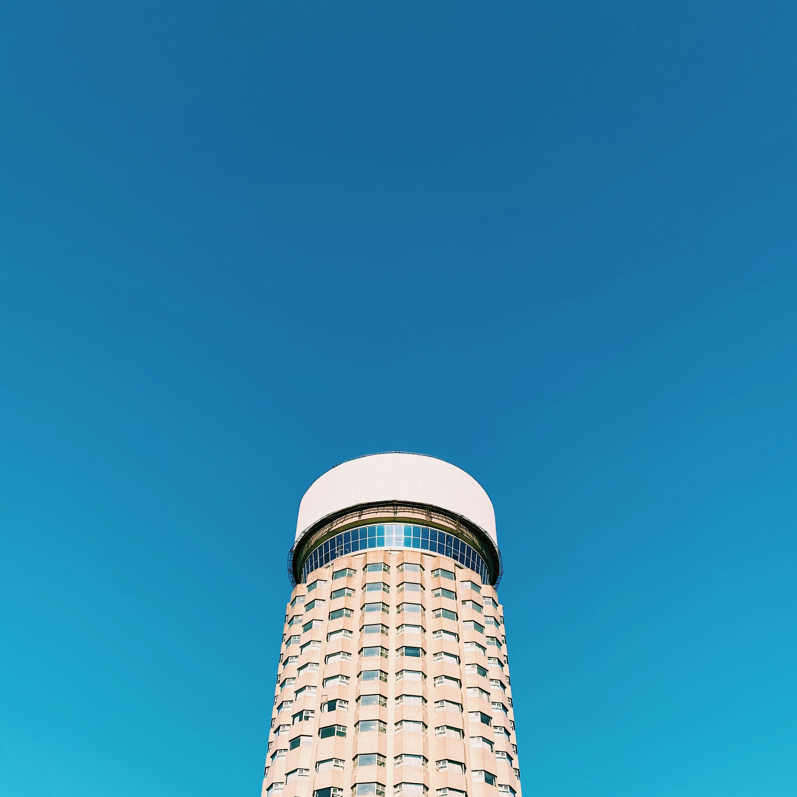 a tall building with a sky background
