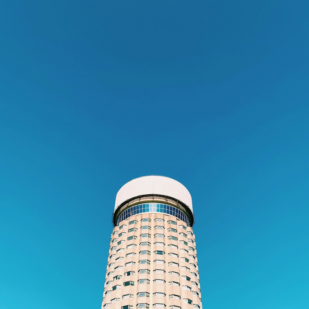 a tall building with a sky background