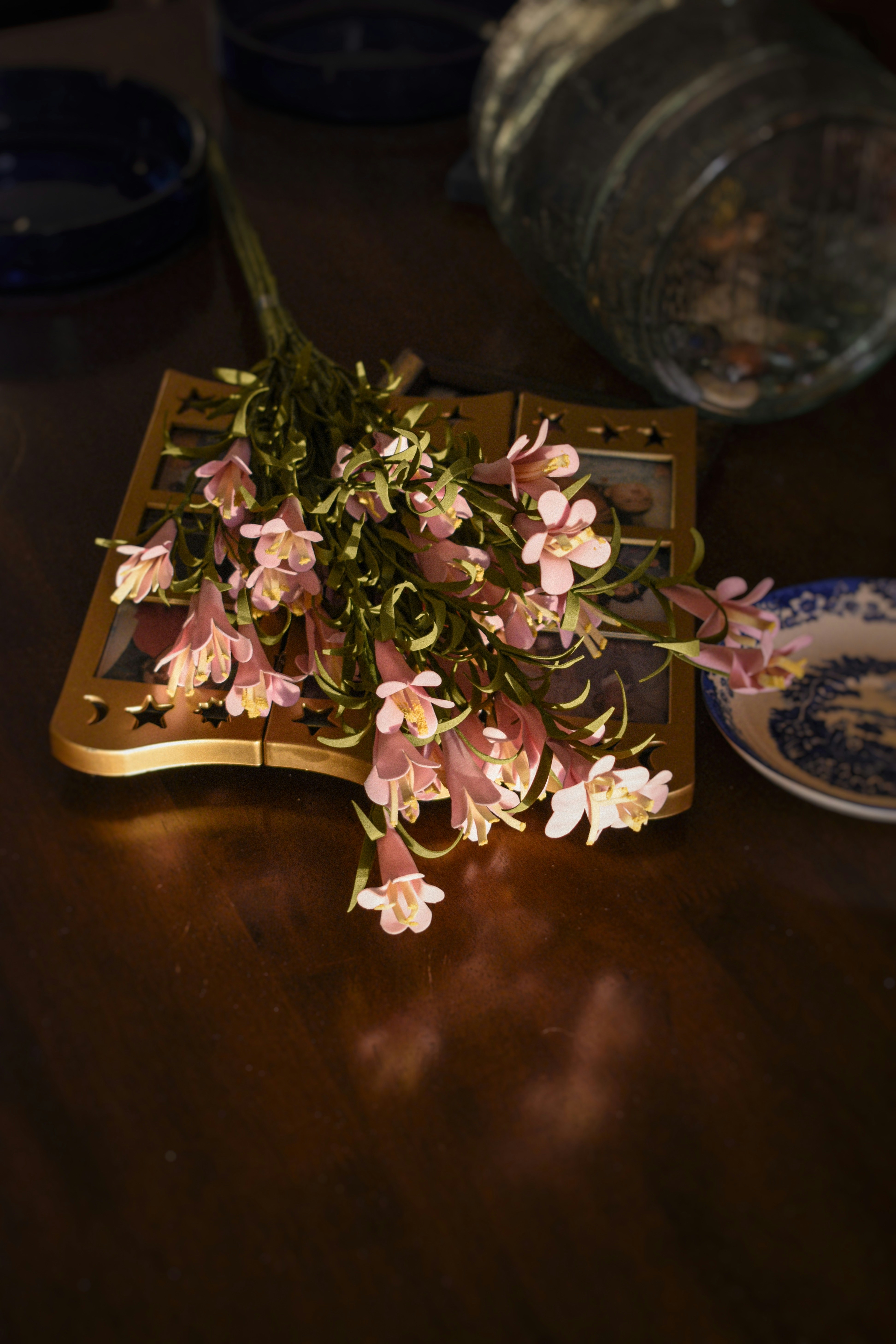 a bunch of flowers sitting on top of a wooden table
