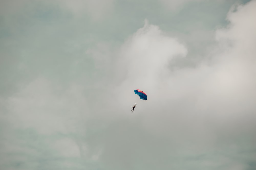 a kite flying in the sky on a cloudy day