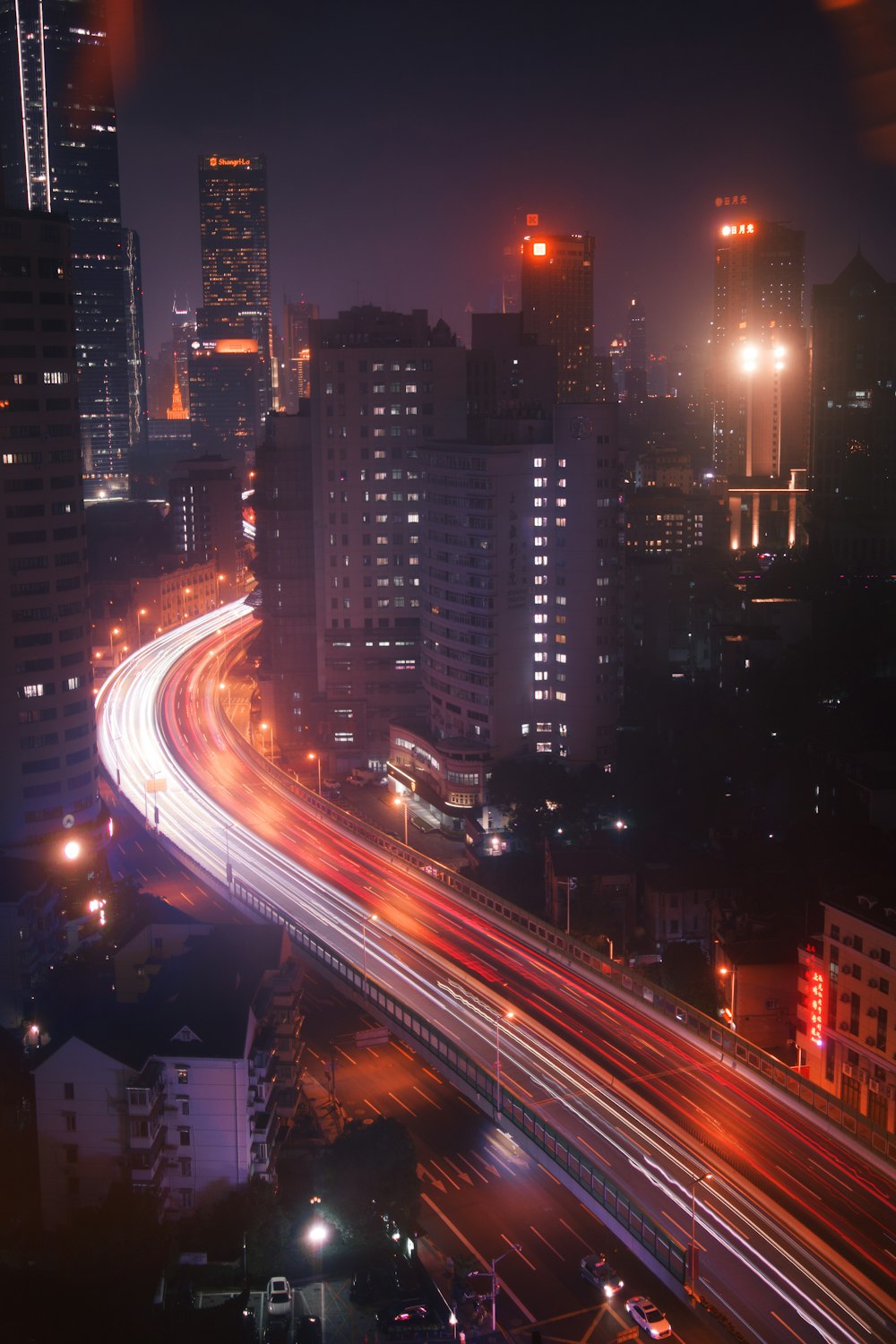 a city at night with a lot of traffic