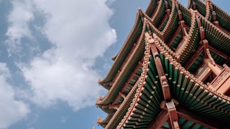 a tall building with a sky background