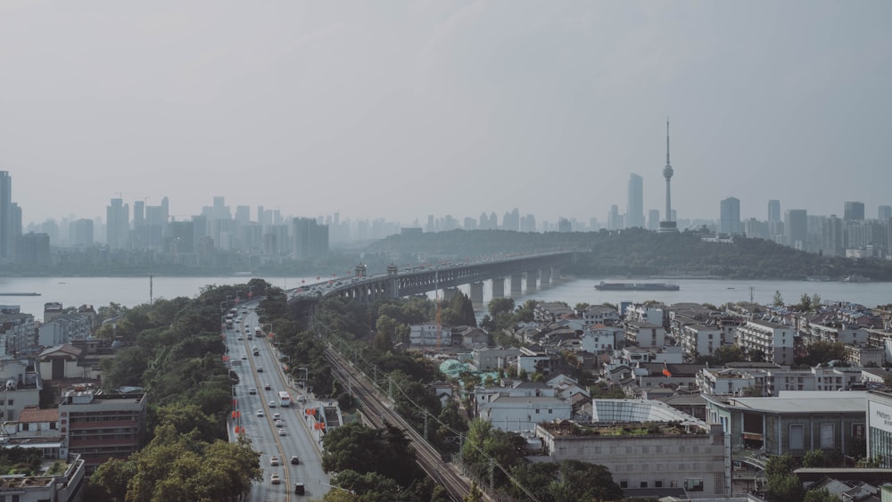 a view of a city with a bridge in the background