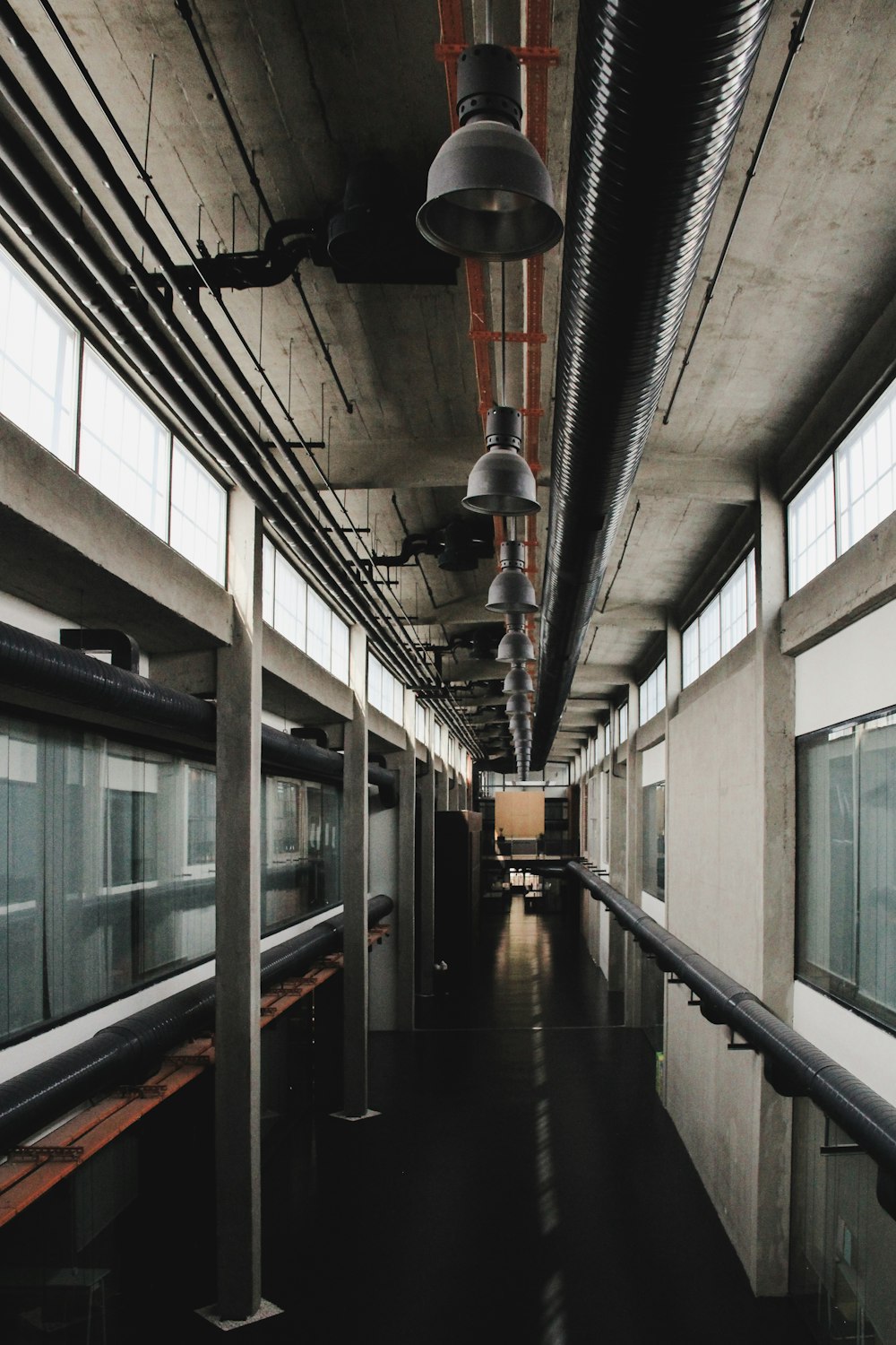 a long hallway with a train on the other side