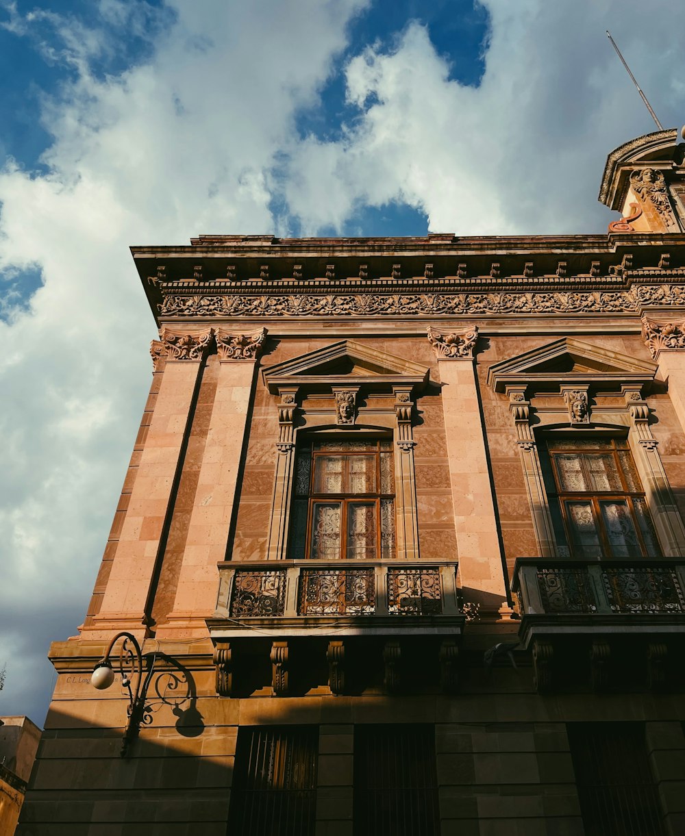 an old building with a balcony and balconies