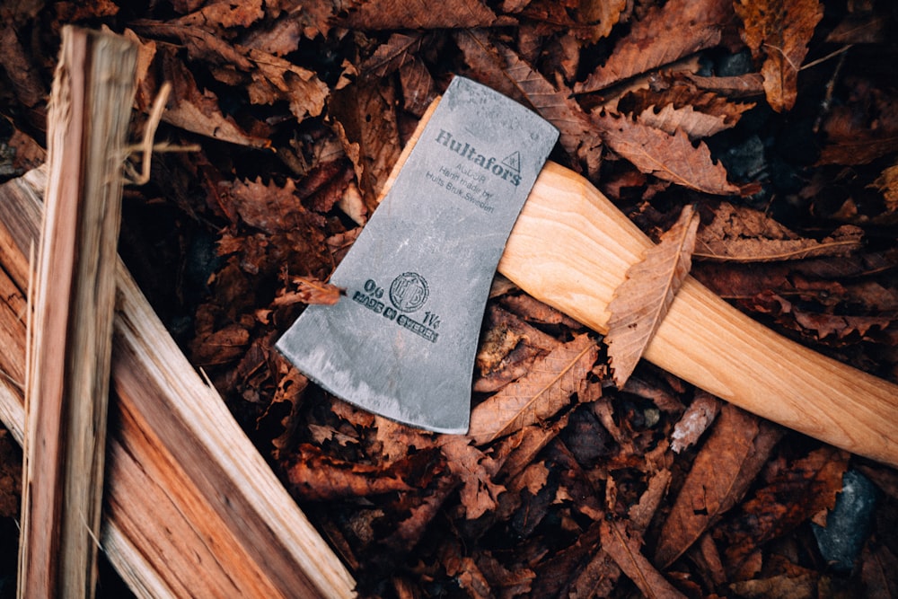 an old axe is laying on the ground