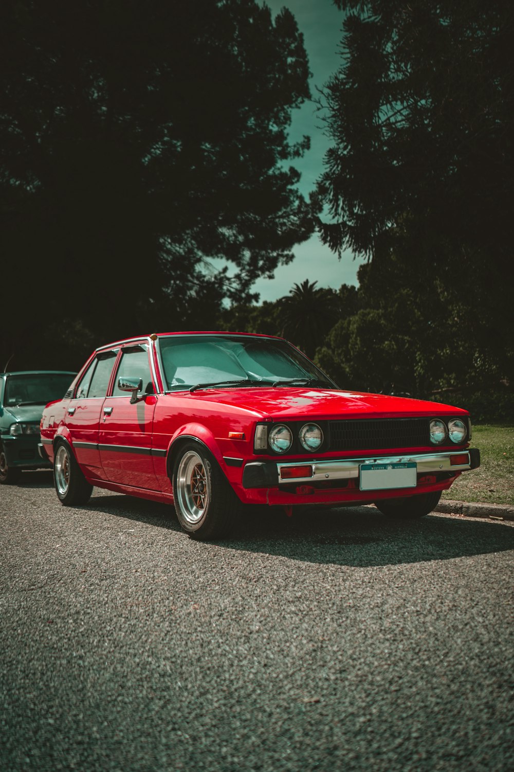 a red car parked on the side of the road