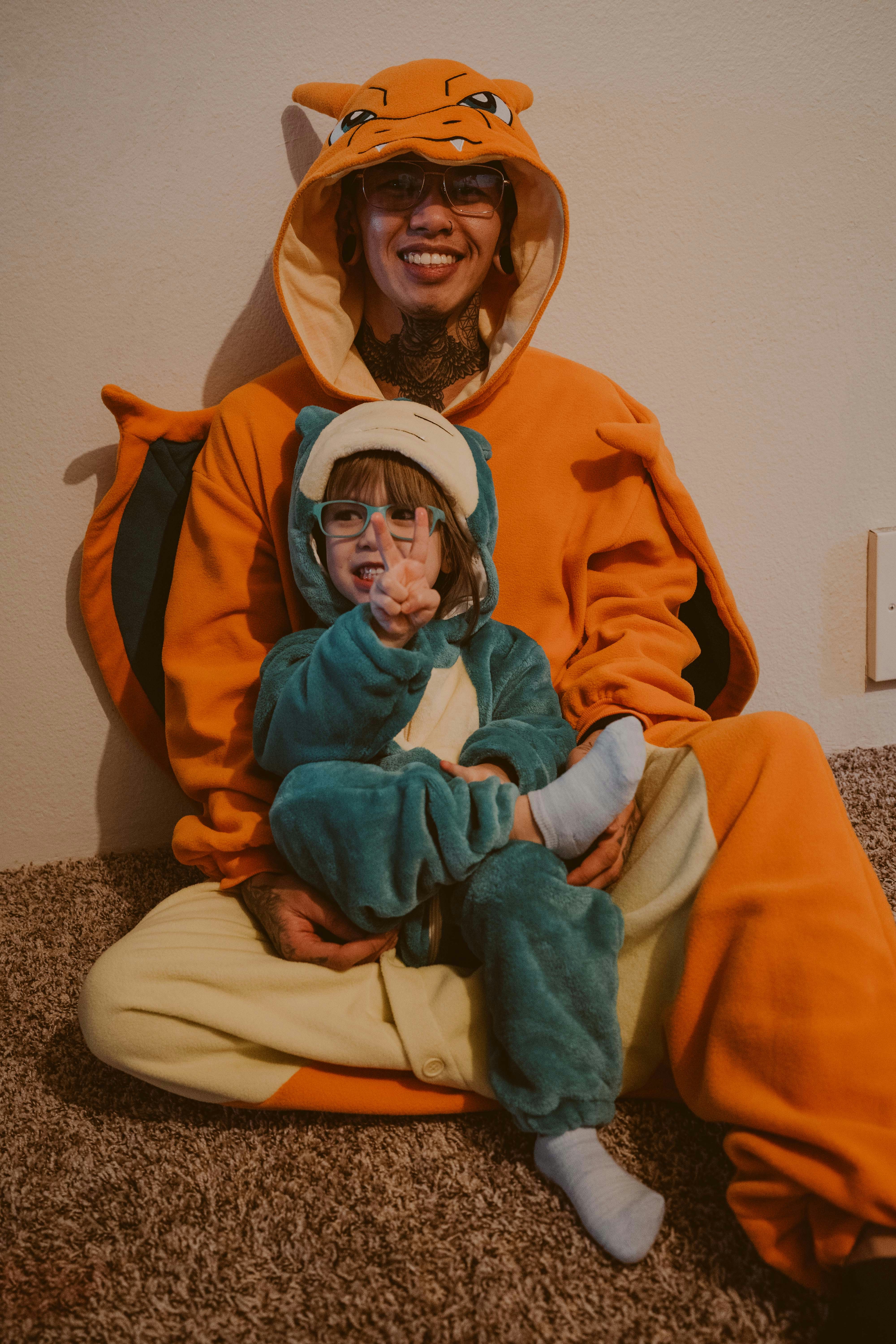 a man and a child dressed up in animal costumes
