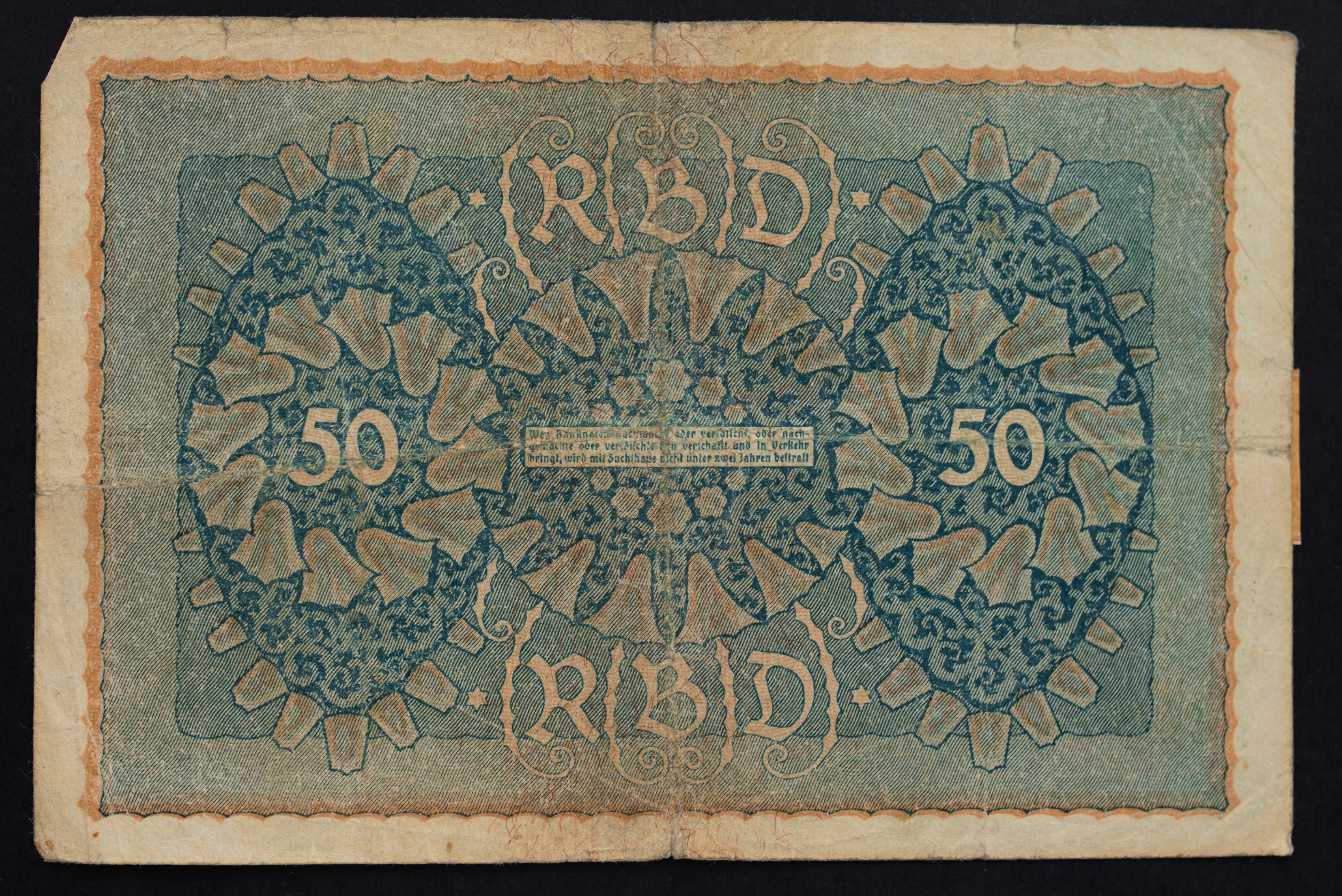 a blue and green fifty pound note