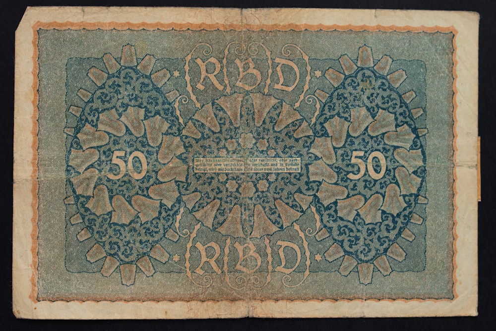 a blue and green fifty pound note