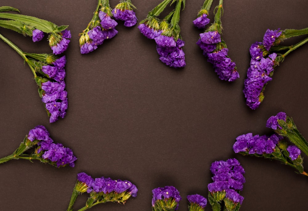 a bunch of purple flowers laying on top of a table