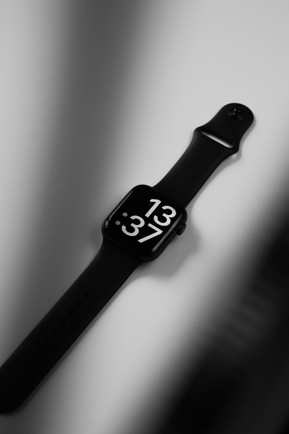 a black and white photo of an apple watch