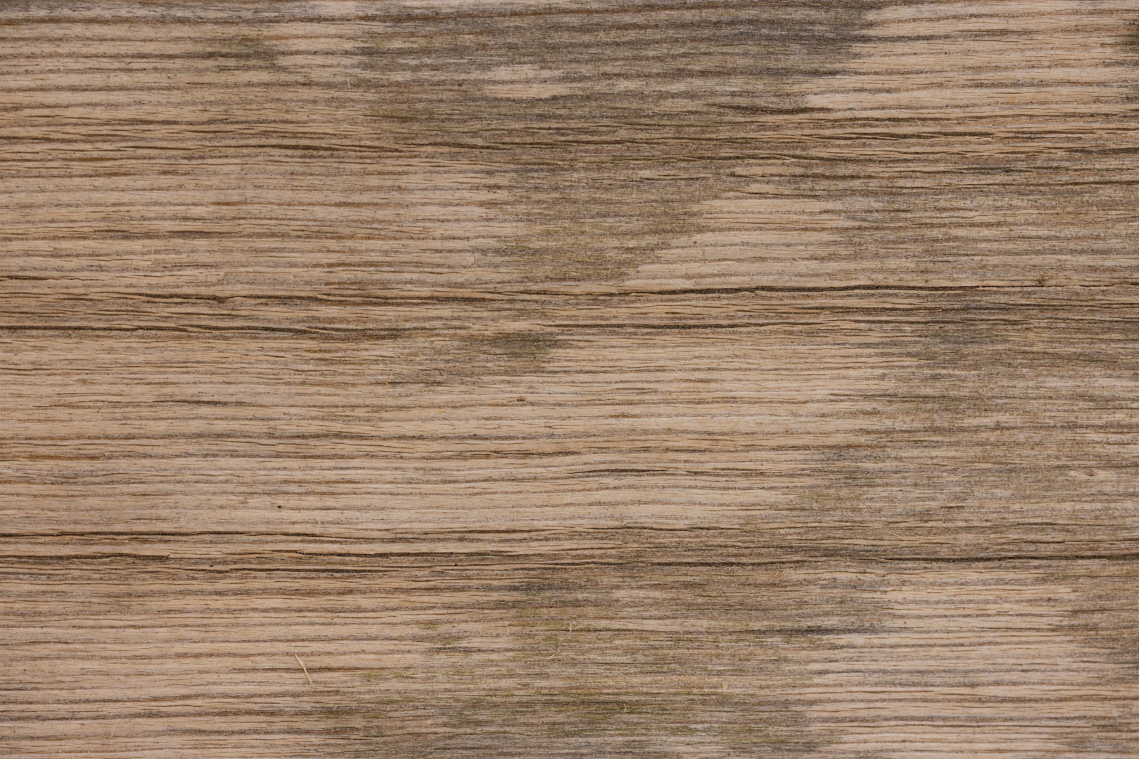 A sequenced veneer face on a drawer bank — figured timber over a stable substrate