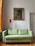 A beautiful painting by baussant art displayed in a cozy living room.