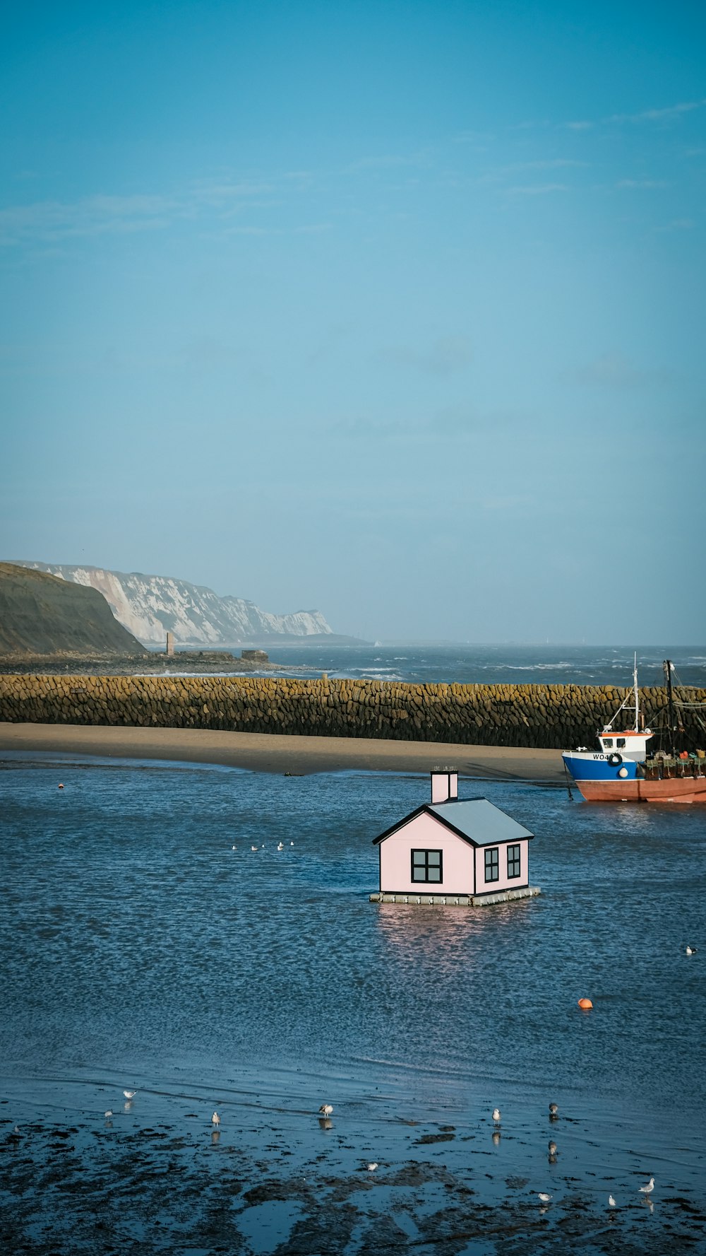 a house in the middle of a body of water