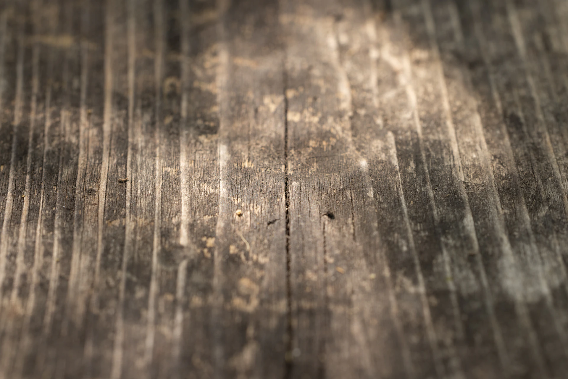 a close up of a wooden surface with peeling paint