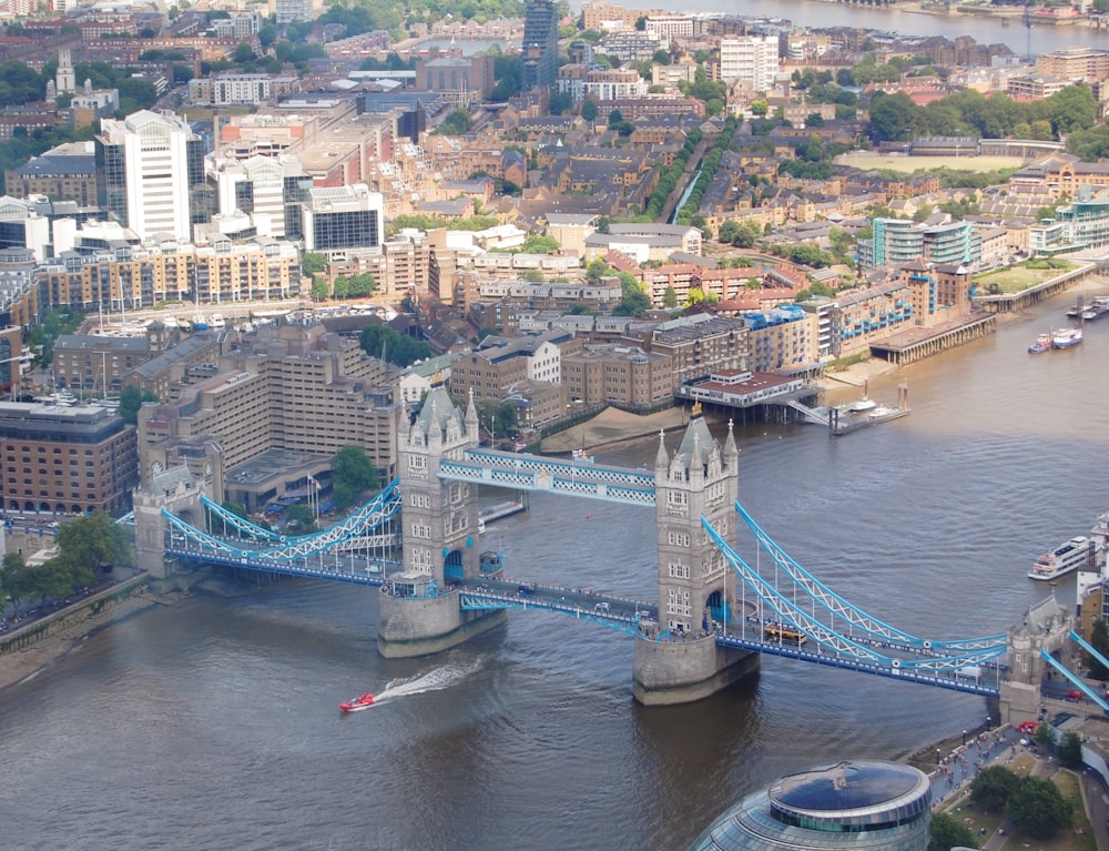 an aerial view of a bridge spanning the width of a city