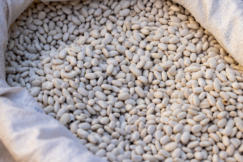 a bag filled with beans sitting on top of a table