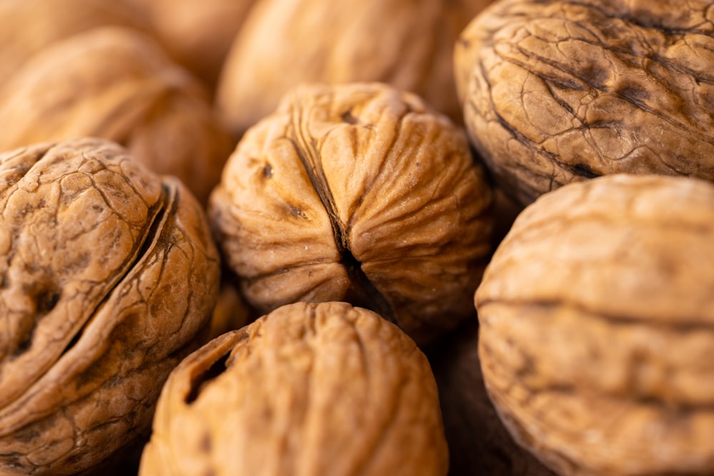 a pile of walnuts sitting on top of each other