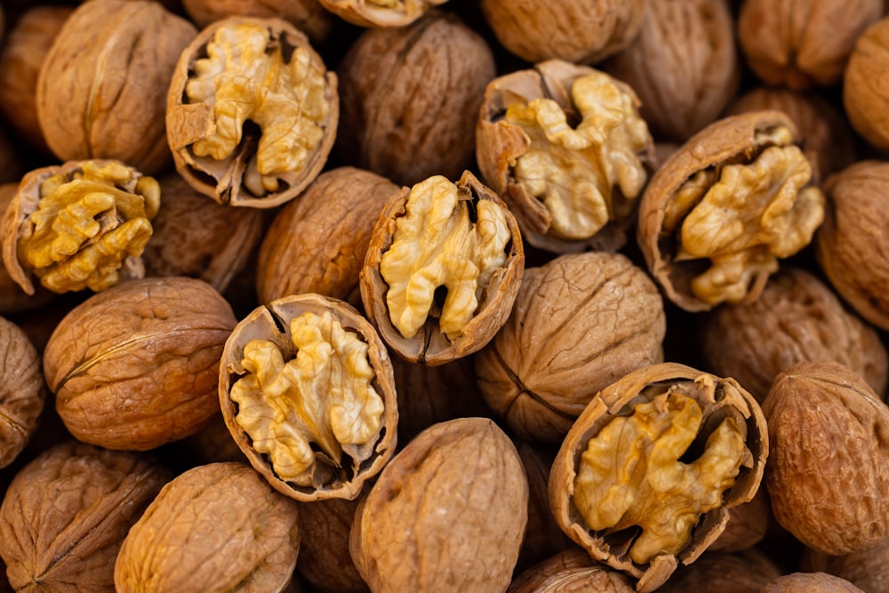 a pile of walnuts that have been opened