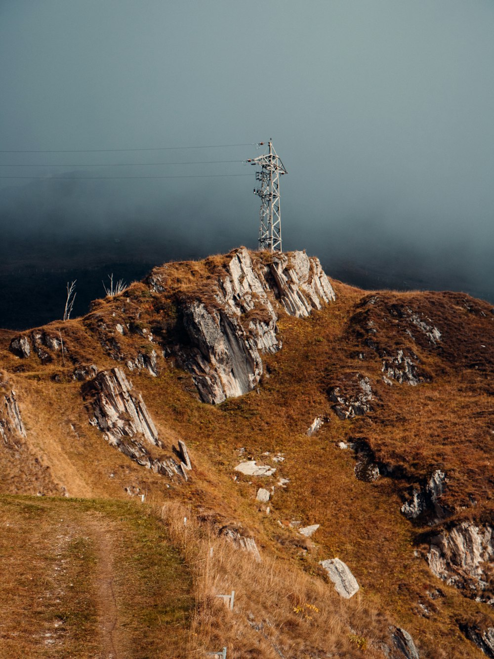 a hill with a telephone pole on top of it