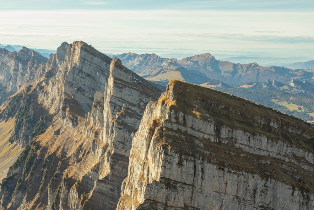 a view of a mountain range from the top of a mountain