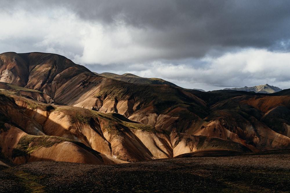 a view of a mountain range with a cloudy sky