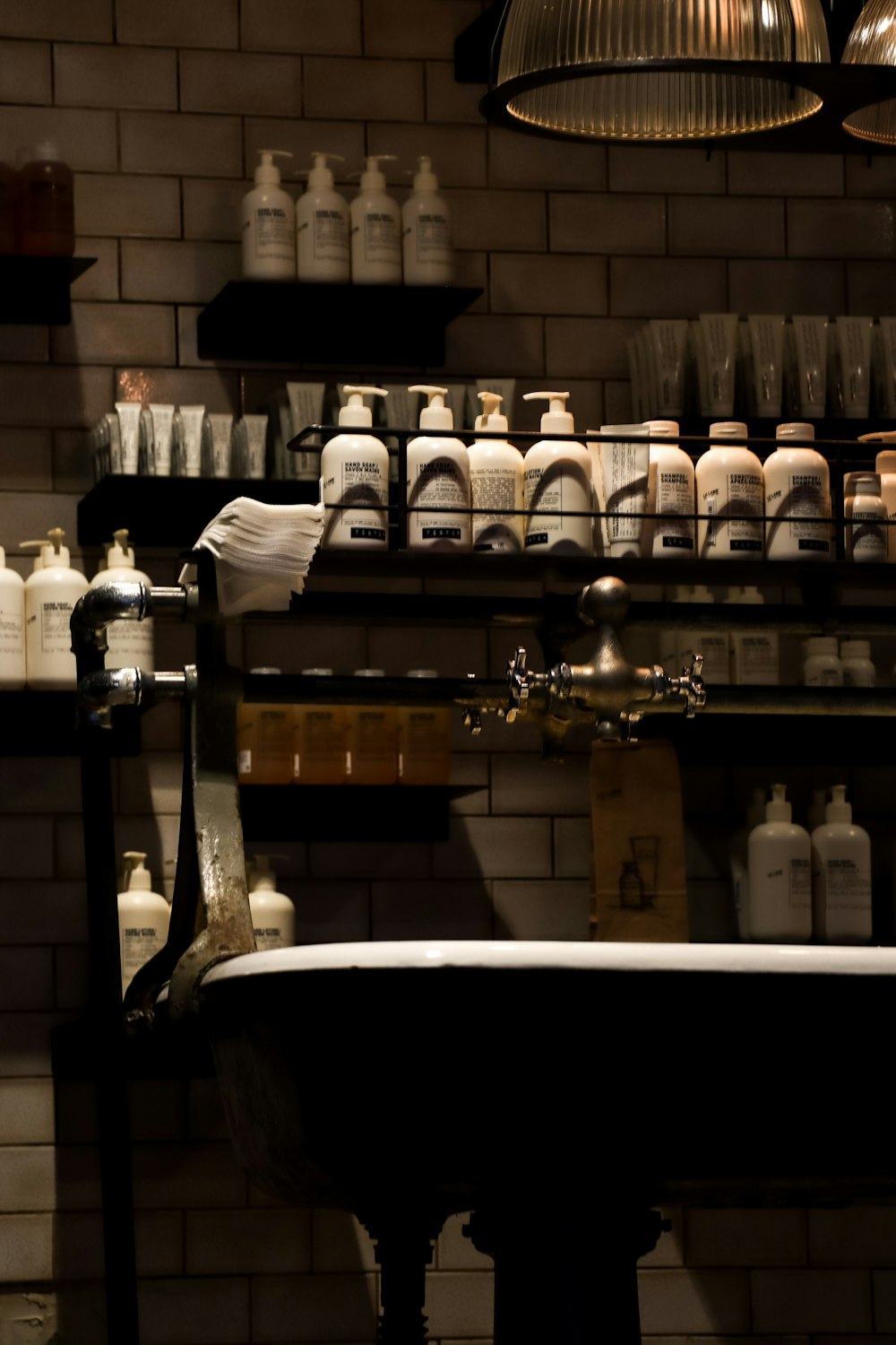 a bath tub sitting in a bathroom under a light