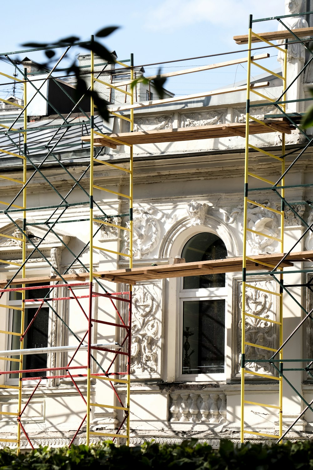 a building with scaffolding around the windows